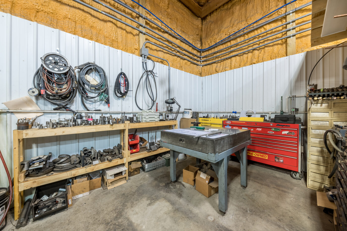 To the left of work area